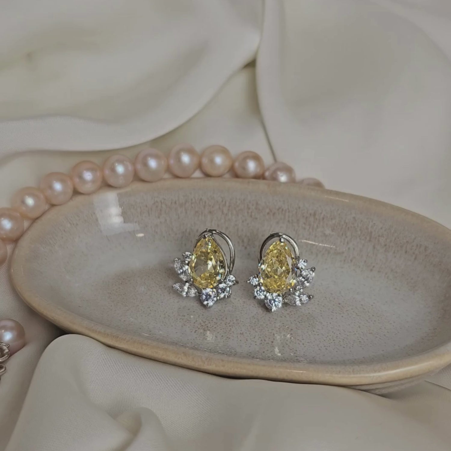 Load video: Pear Shape Yellow and White Swarovski  Clustered Studs
